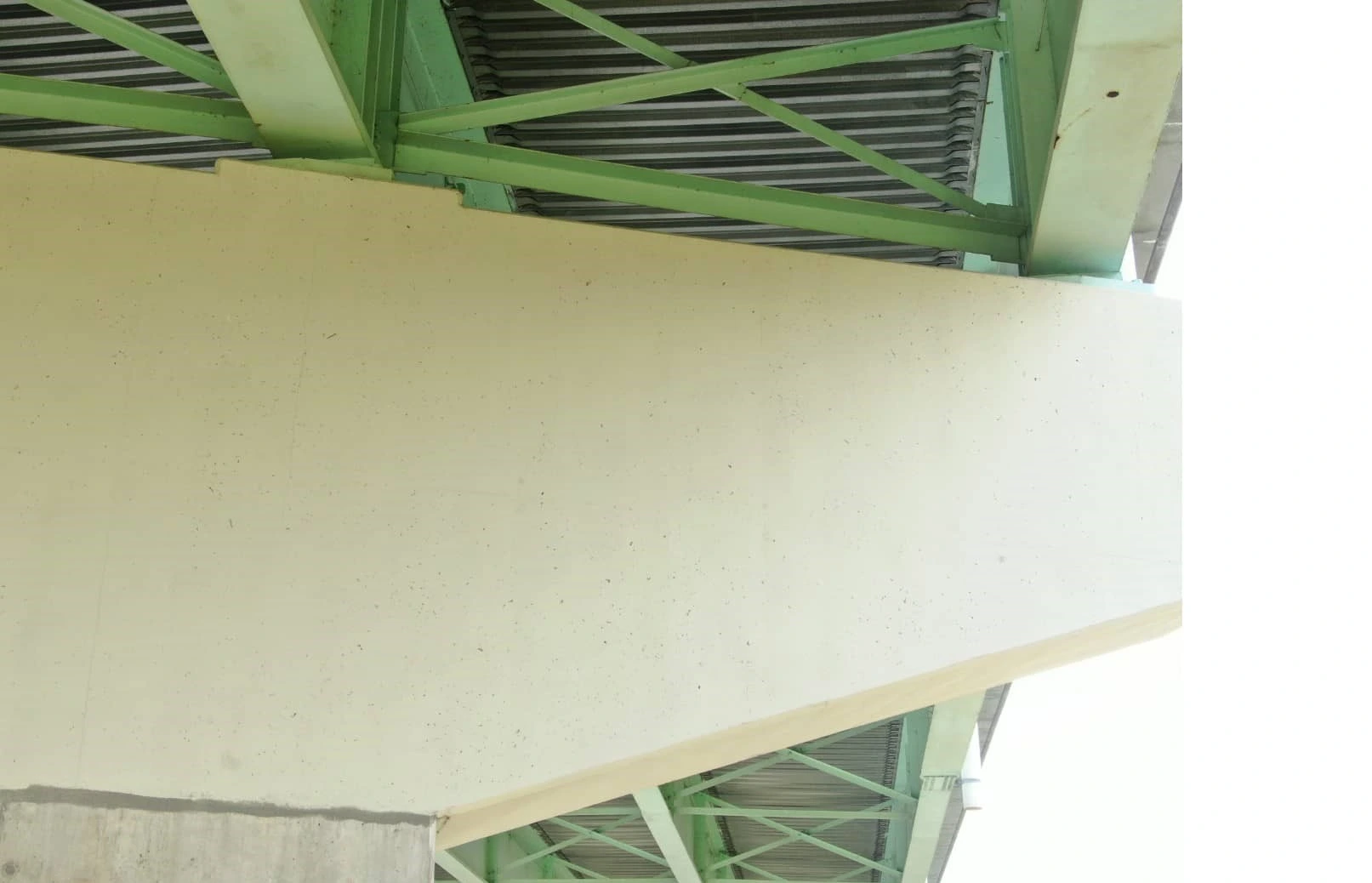 A photo taken by a UAS shows a concrete pier cap supporting a bridge.